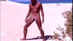 Tanned guy on beach in tiny string thong (temporarily!)