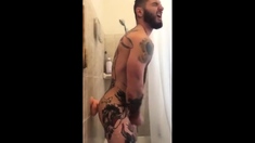 Tatted Hunk Fucks Dildo In Shower Until He Cums